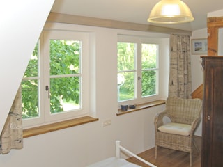 Bedroom 2 on the upper floor looking out onto the trees