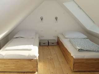 Bedroom loft on the top floor with large skylight