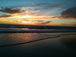 Am Strand bei Sonnenuntergang