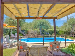 Shady place by the pool of the villa in Sicily