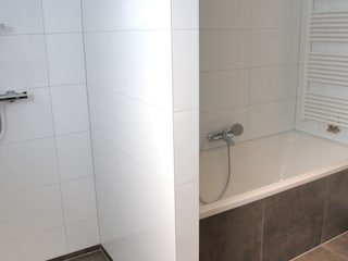 Das Badezimmer mit Badewanne und Dusche