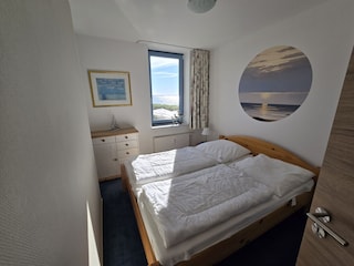 Separates Schlafzimmer mit Doppelbett
