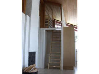 12.	A staircase leads to the loft above the entrance