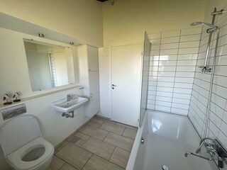 Bathtub with shower. High quality bathroom