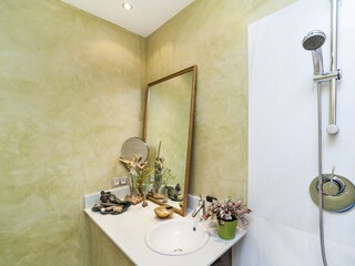 even the bathroom is lovely furnished and decorated